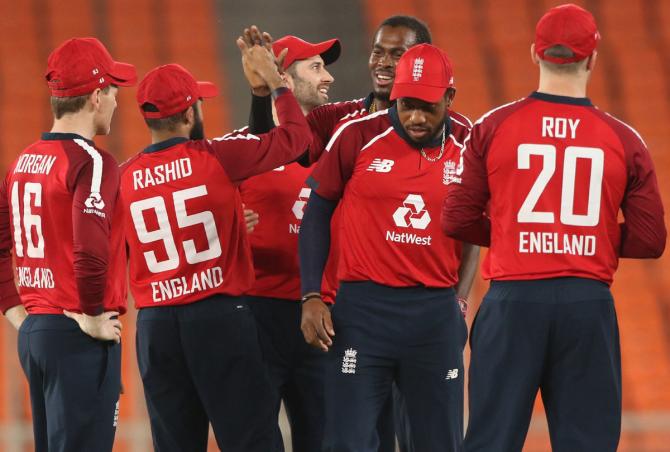 Jofra Archer celebrates with his England teammates after dismissing India's Rohit Sharma in the fourth T20I in Ahmedabad on Thursday. 