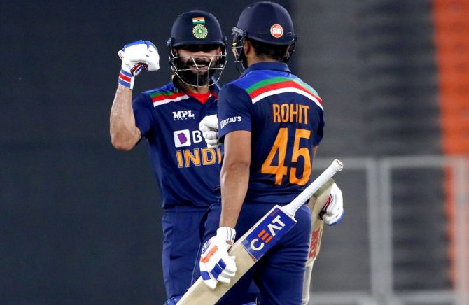 Virat Kohli and Rohit Sharma celebrate a six