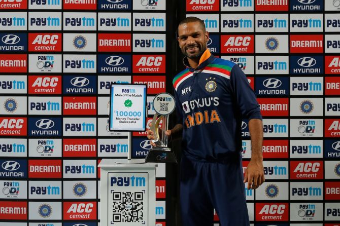 India opener Shikhar Dhawan is all smiles after receiving the Man of the Match award in the 1st One-Day International against England, in Pune, on Tuesday.