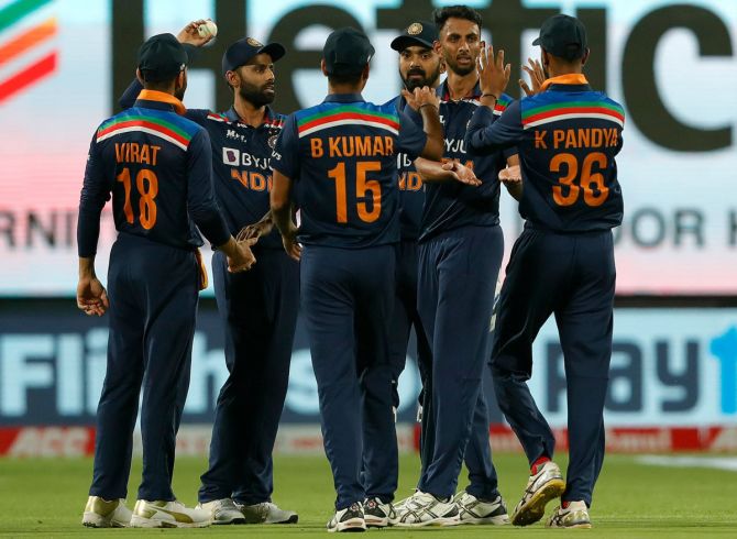 India's debutant pacer Prasidh Krishna celebrates with teammates after dismissing England opener Jason Roy in the first ODI, in Pune, on Tuesday.