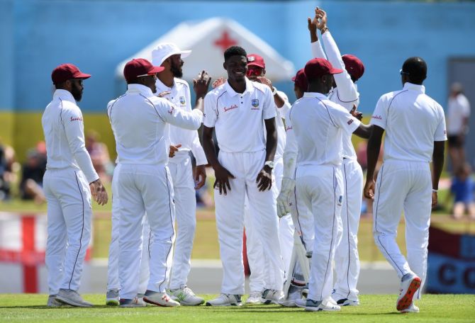 West Indies players celebrate. 