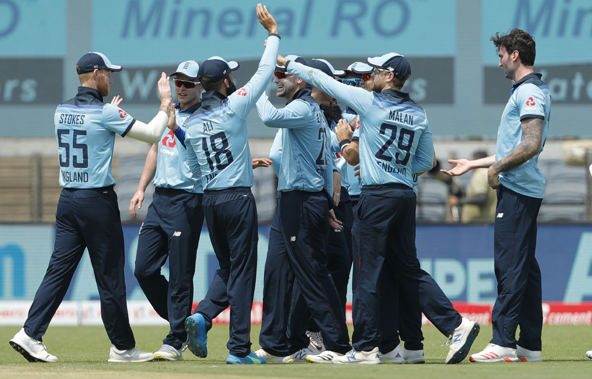 England players celebrate the wicket of Shikhar Dhawan