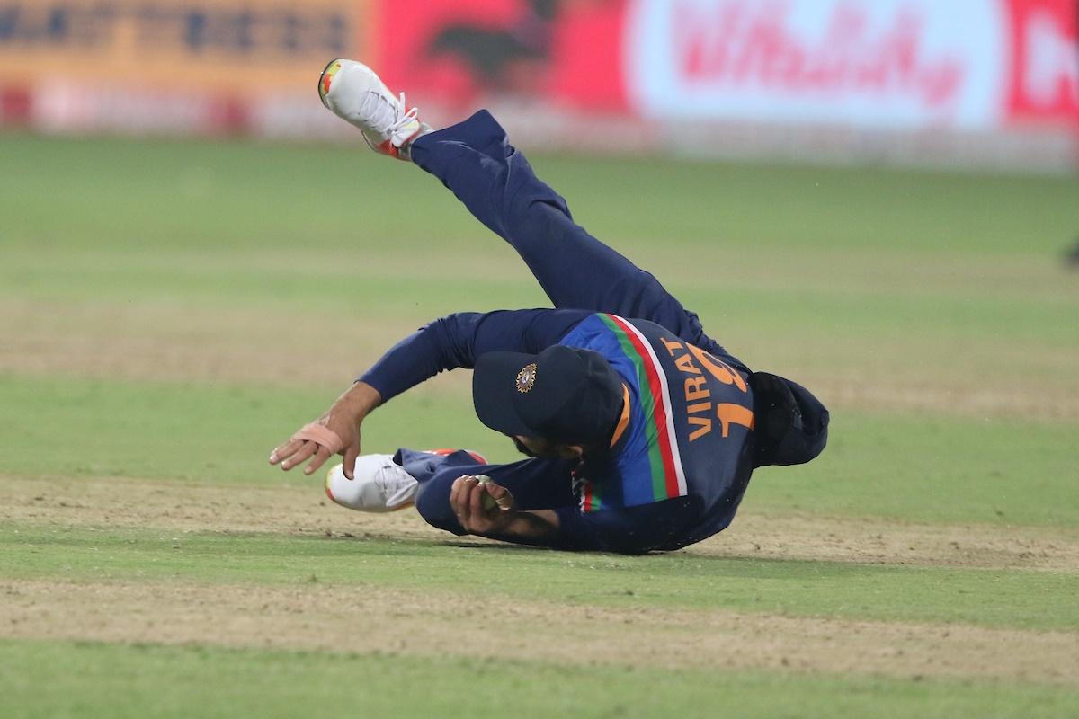 Virat Kohli takes the catch to dismiss Adil Rashid 