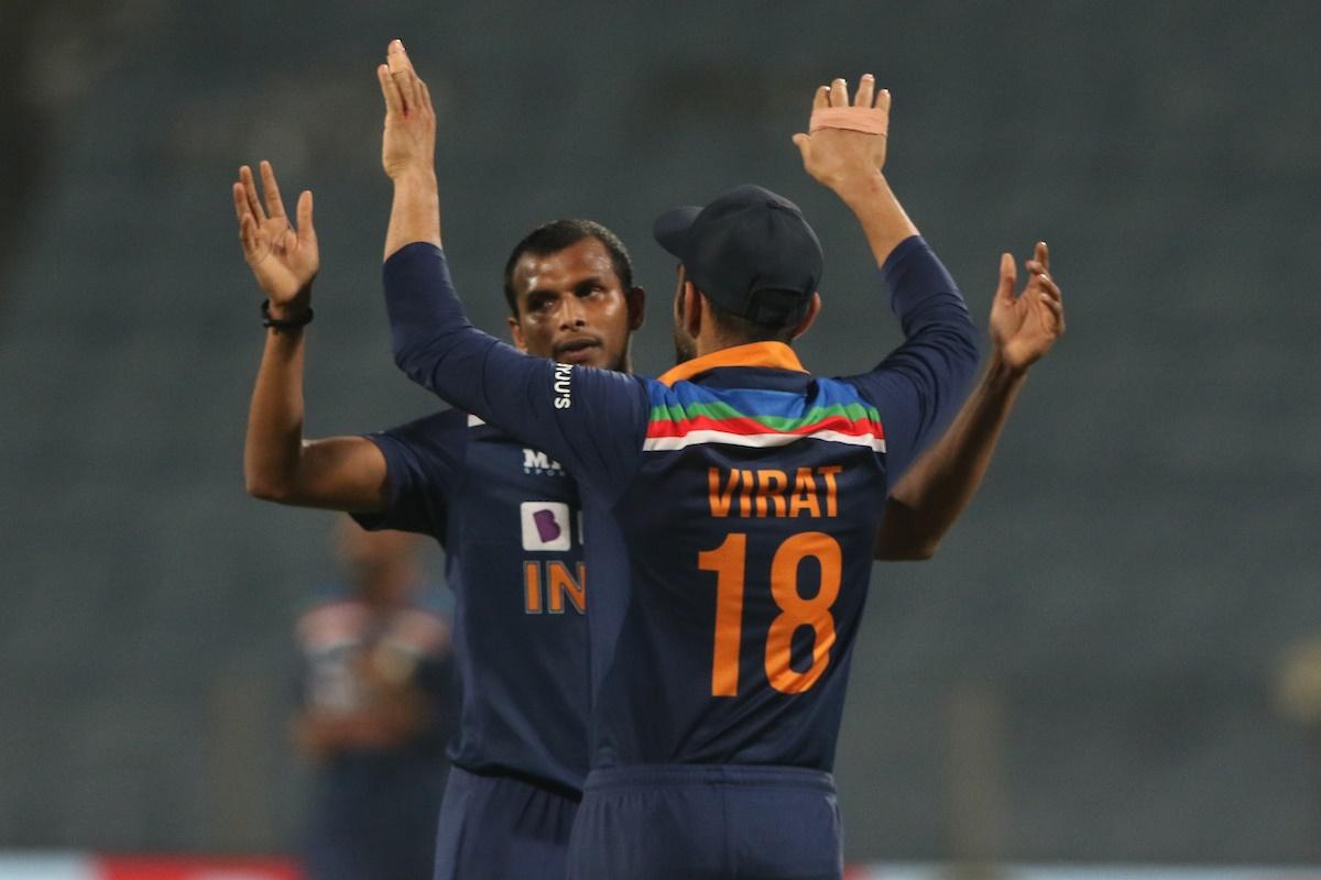 Virat Kohli celebrates victory with T Natarajan, who bowled the last over, in the third One-Day Internationl against England, in Pune, on Sunday.