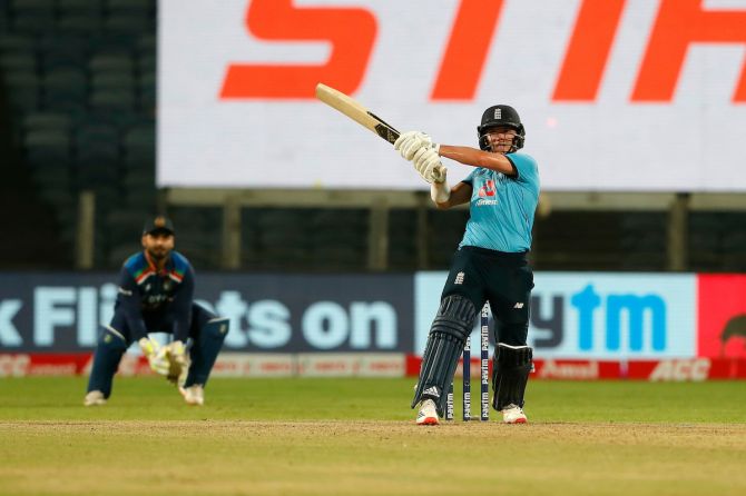 England's Sam Curran sends the ball over the boundary during his unbeaten 95 in the third ODI against India in Pune on Sunday.