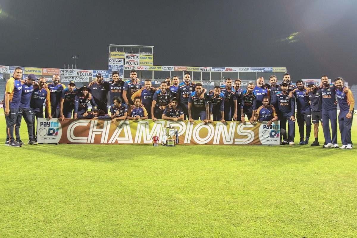 India’s players pose for the camera after defeating England in the third ODI and winning the series 2-1, in Pune, on Sunday