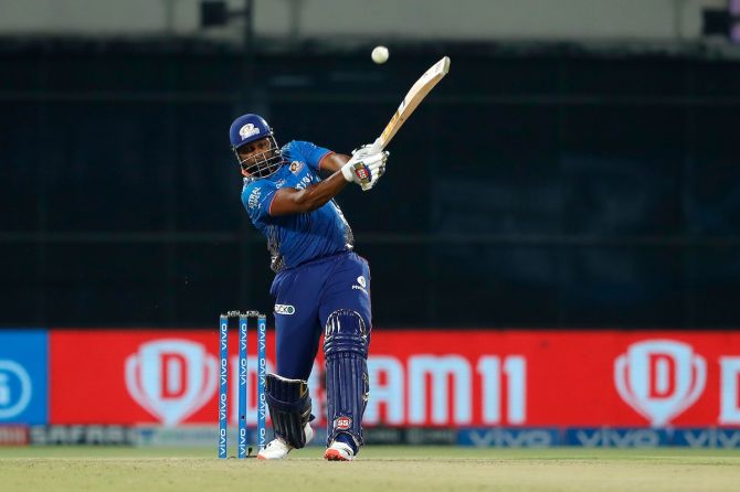 Mumbai Indians batsman Kieron Pollard hits a six during the IPL match against Chennai Super Kings, in Delhi, on Saturday. 