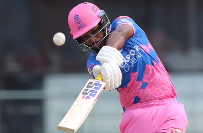 Sanju Samson steps out to send the ball to the boundary