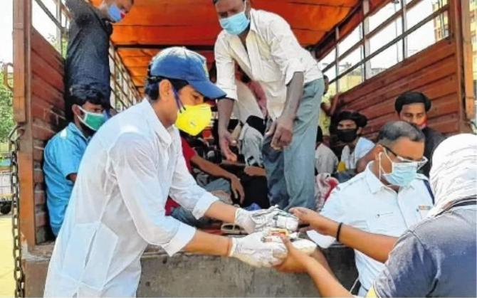 Laxmi Ratan Shukla feeds the needy during one of his charity drives