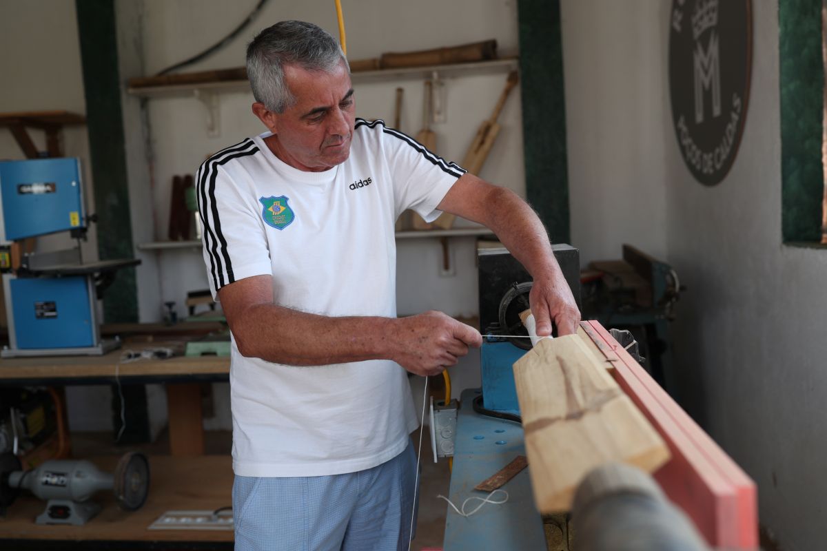 Luiz Roberto Francisco works on a bat at Royal Bats factory in Pocos de Caldas, Minas Gerais state, Brazil