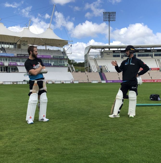 Kane Williamson and a teammate chat during a training session in Southampton on Tuesday