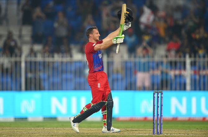 England's Jos Buttler celebrates after completing a magnificent hundred off the last delivery of the innings during the T20 World Cup Super 12s match against Sri Lanka, at Sharjah Cricket Stadium, on Monday.