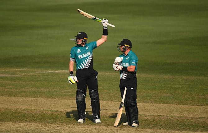 Martin Guptill celebrates his half century with Glenn Phillips