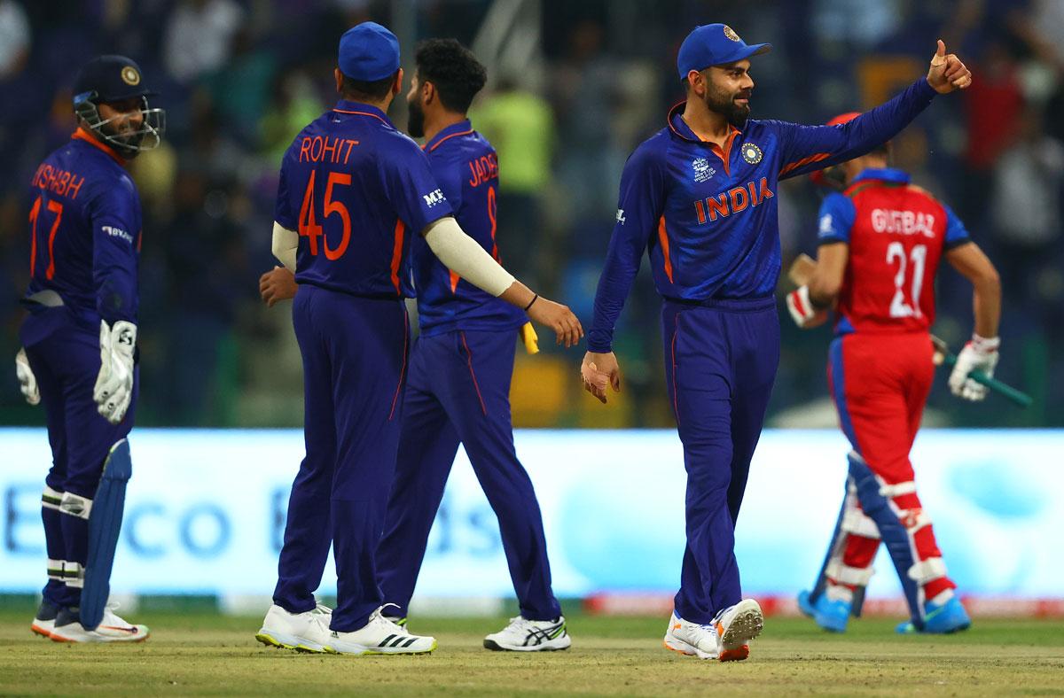 India's players celebrate the wicket of Rahmanullah Gurbaz. 