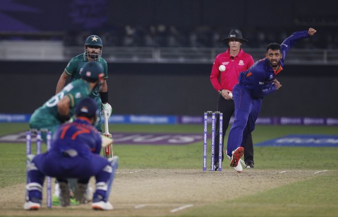 India's Varun Chakravarthy in action during the T20 World Cup Super 12s match against Pakistan, at Dubai International Stadium, on October 24, 2021. 