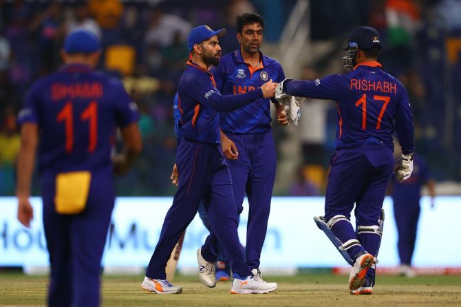 India's Ravichandran Ashwin celebrates with teammates Rishabh Pant and Virat Kohli after dismissing Afghanistan's Najibullah Zadran in the T20 World Cup Super 12s match, at Sheikh Zayed stadium in Abu Dhabi, on Wednesday. 