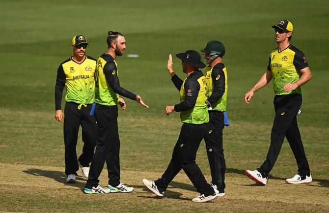 Glenn Maxwell is congratulated by his Australian teammates after dismissing Mushfiqur Rahim.