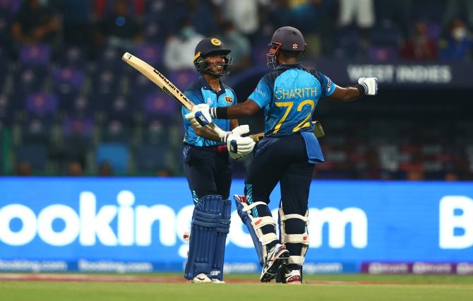 Sri Lanka's Pathum Nissanka is congratulated by Charith Asalanka after completing his half century.