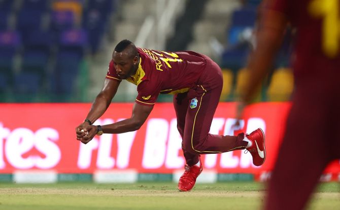 West Indies pacer Andre Russell takes the catch off his own bowling to dismiss Kusal Perera.