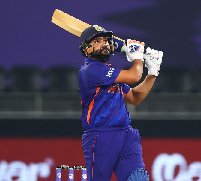 Rohit Sharma sends the ball to the boundary during his 16-ball 30.