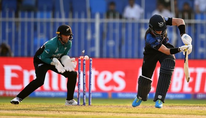 Namibia's opener Stephan Baard is bowled by New Zealand spinner Mitchell Santner.