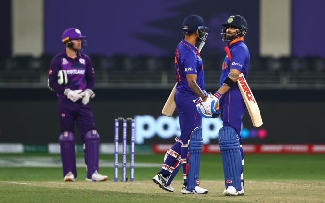 Suryakumar Yadav and Virat Kohli celebrate victory.