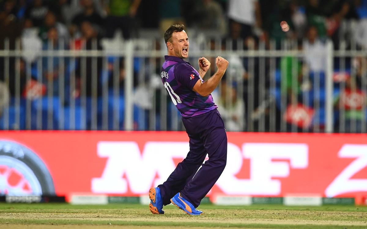 Scotland's spinner Chris Greaves celebrates the wicket of Fakhar Zaman.