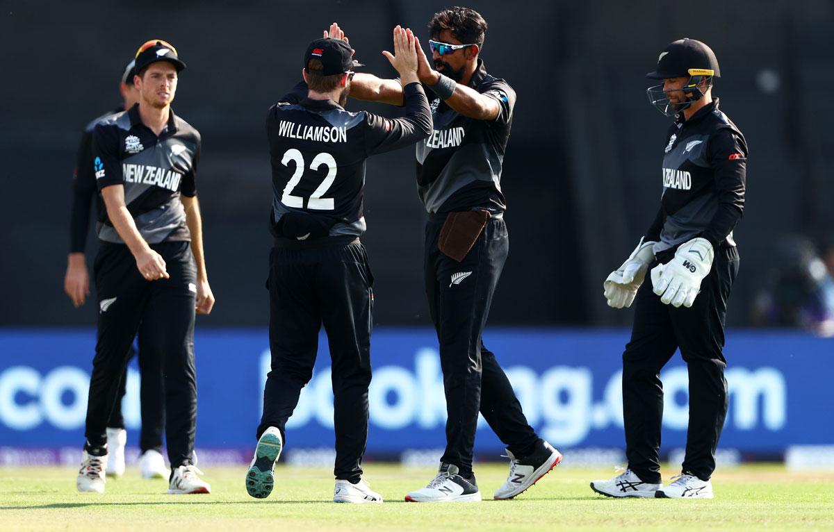 Ish Sodhi celebrates the wicket of Gulbadin Naib with Kane Williamson.