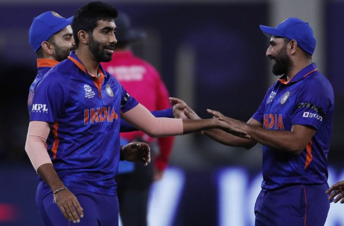 India pacer Jasprit Bumrah celebrates with teammates after dismissing Namibia opener Michael van Lingen 