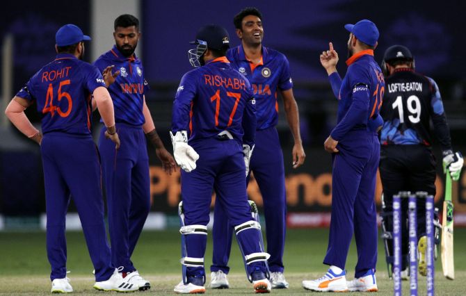 India's players celebrate after Ravichandran Ashwin dismisses Jan Nicol Lofie-Eaton 