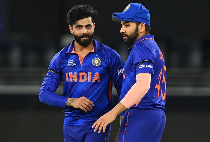 India spinner Ravindra Jadeja celebrates with Rohit Sharma after dismissing Namibia's Craig Williams during the T20 World Cup Super 12s match, in Dubai, on Monday.
