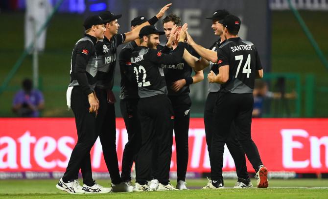 Adam Milne celebrates the wicket of Jonathan Bairstow with teammates.