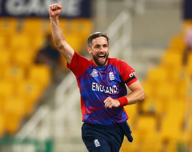 Chris Woakes celebrates the wicket of Kane Williamson.