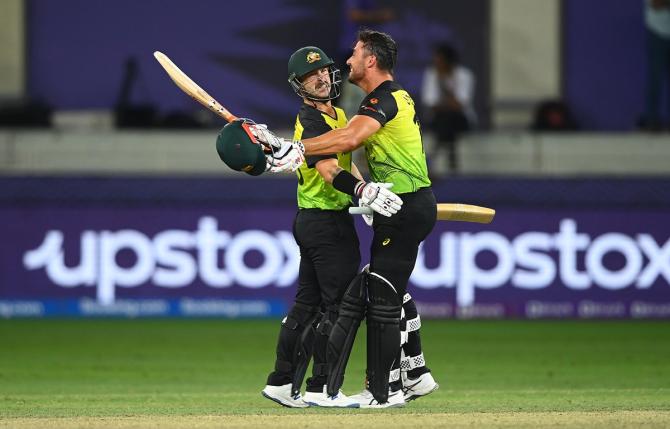 Matthew Wade celebrates with Marcus Stoinis after scoring the winning runs to take Australia past Pakistan to the final of the T20 World Cup, at Dubai International Stadium