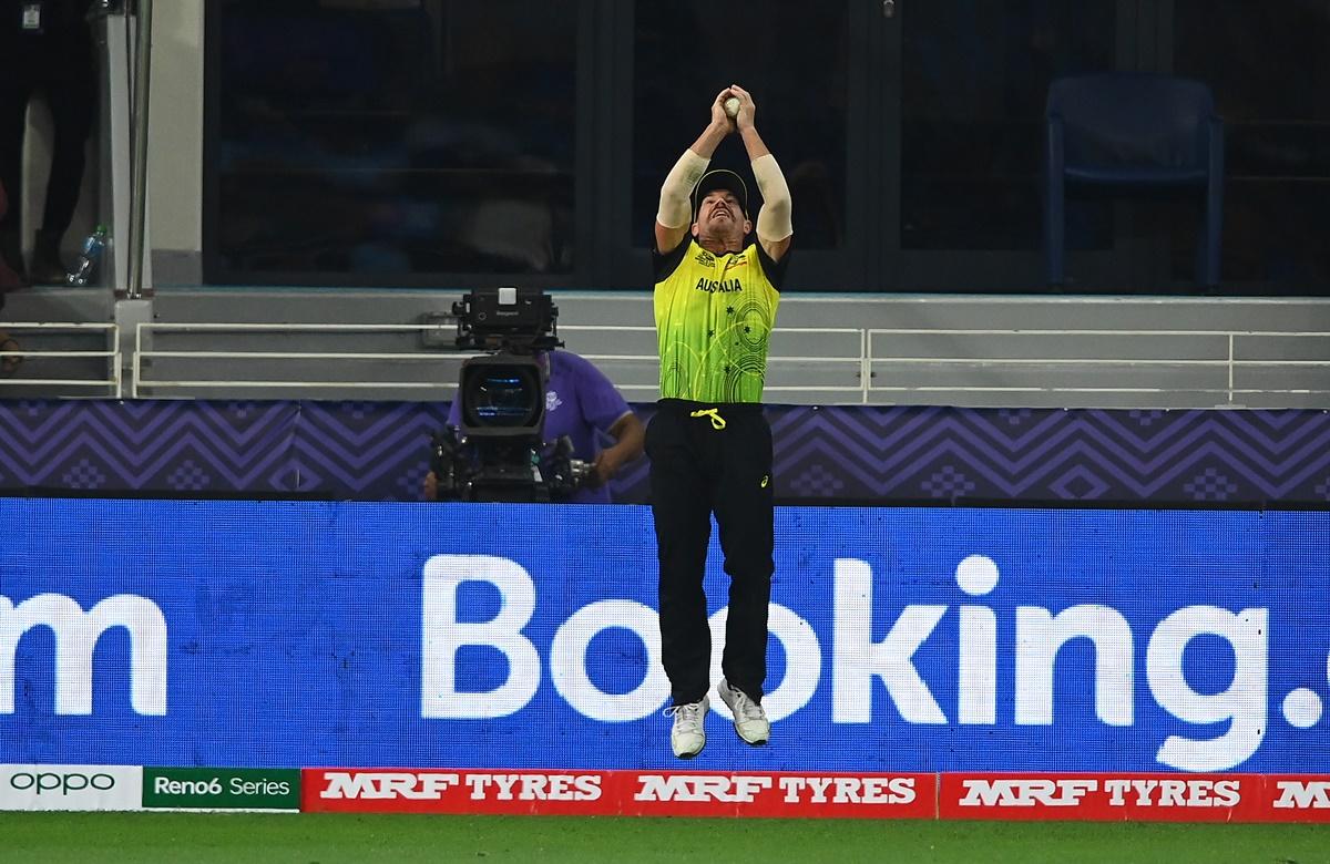 David Warner catches Babar Azam just ahead of the boundary rope.