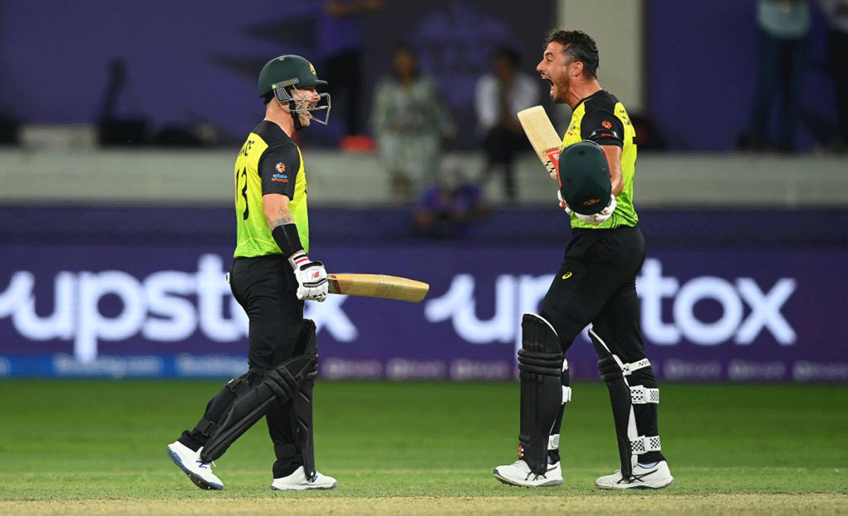 Australia's Matthew Wade celebrates with Marcus Stoinis after hitting the winning runs to beat Pakistan by 5 runs and win the ICC Men's T20 World Cup semi-final at Dubai International Stadium in Dubai, United Arab Emirates, on Thursday