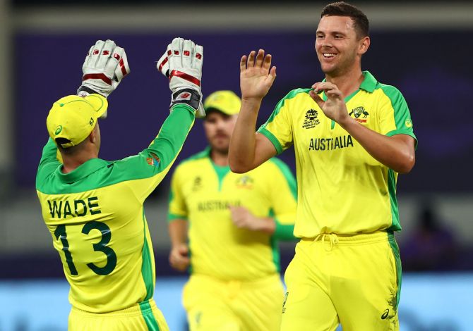 Australia pacer Josh Hazlewood celebrates the wicket of New Zealand opener Daryl Mitchell. 