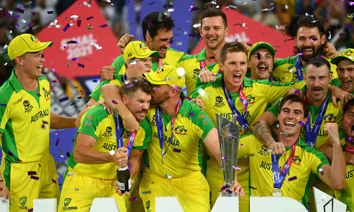 Australian captain Aaron Finch kisses David Warner as they celebrate after winning the T20 World Cup on Sunday