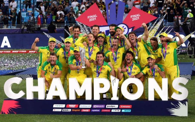 The Australian cricket team celebrates after defeating New Zealand to win the T20 World Cup in the UAE on November 14