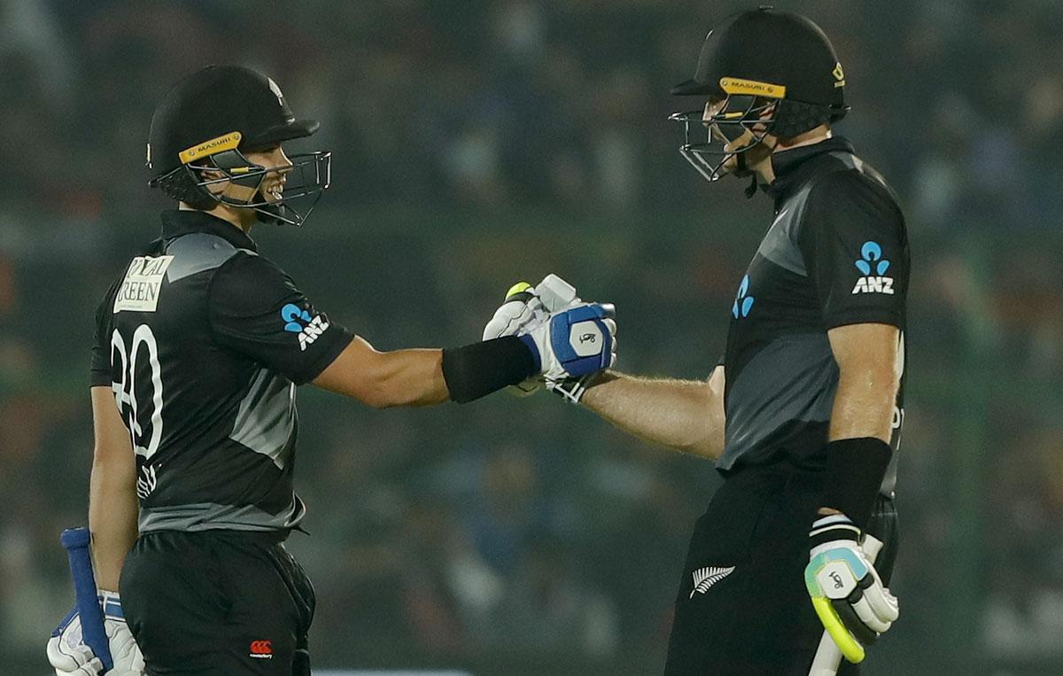 Mark Chapman celebrates his half century with Martin Guptill