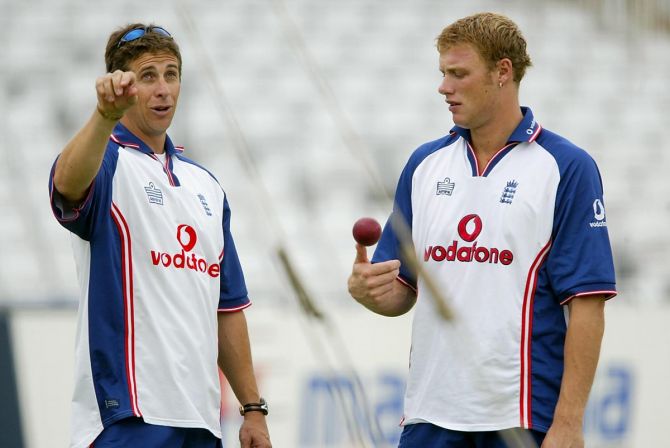 Bowling coach Troy Cooley has a chat with pacer Andrew Flintoff during an England nets session at Trent Bridge in Nottingham, in August 2003.
