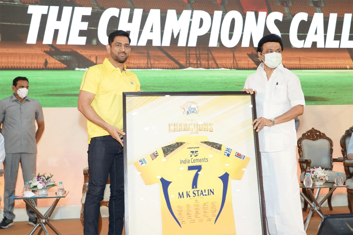 Tamil Nadu Chief Minister MK Stalin receives an autographed Chennai Super Kings jersey from Mahendra Singh Dhoni during a felicitation ceremony, in Chennai on Saturday, held for IPL 2021 champions CSK 