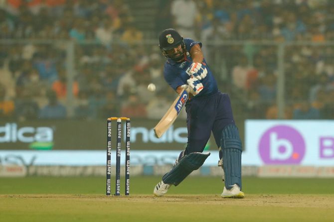 India captain Rohit Sharma sends the ball over the boundary for six.