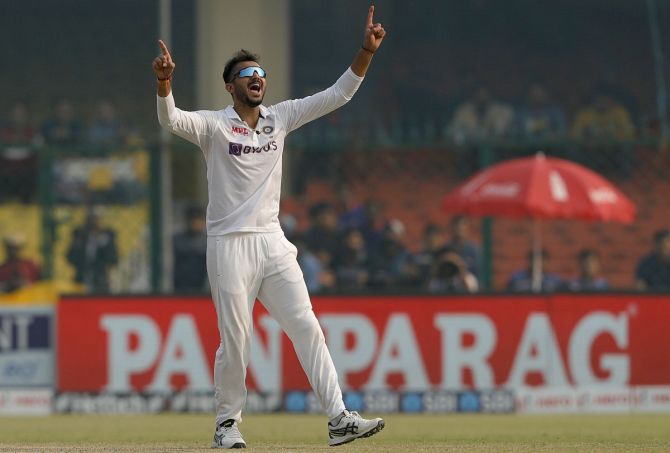 Axar Patel celebrates the wicket of Tim Southee. 