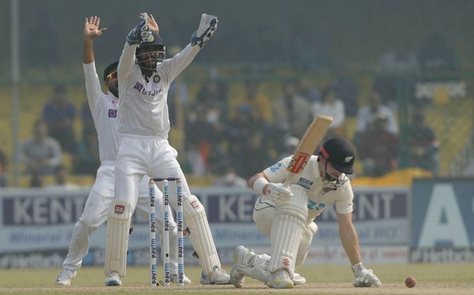 India's players appeal successfully for the wicket Henry Nicholls 