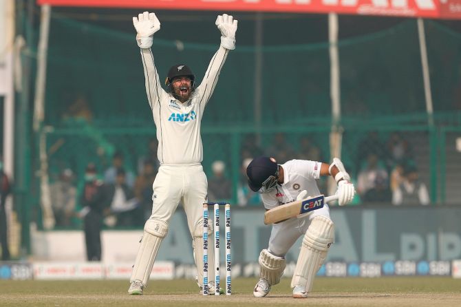 Wicketkeeper Tom Blundell successfully appeals for leg before wicket against Ajinkya Rahane.