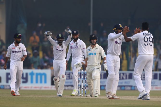 India's players celebrate after Ravichandran Ashwin dismisses New Zealand opener William Young in the second innings on Day 4 of the first Test, at Green Park in Kanpur, on Sunday.