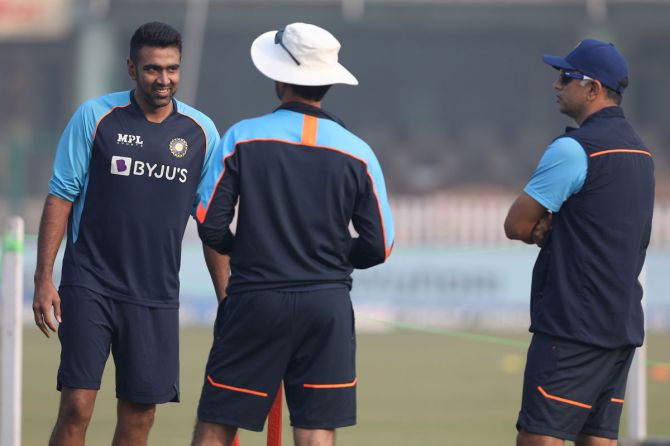 India coach Rahul Dravid watches Ravichandran Ashwin during practice ahead of the fifth day's play in the first Test against New Zealand in Kanpur on Monday
