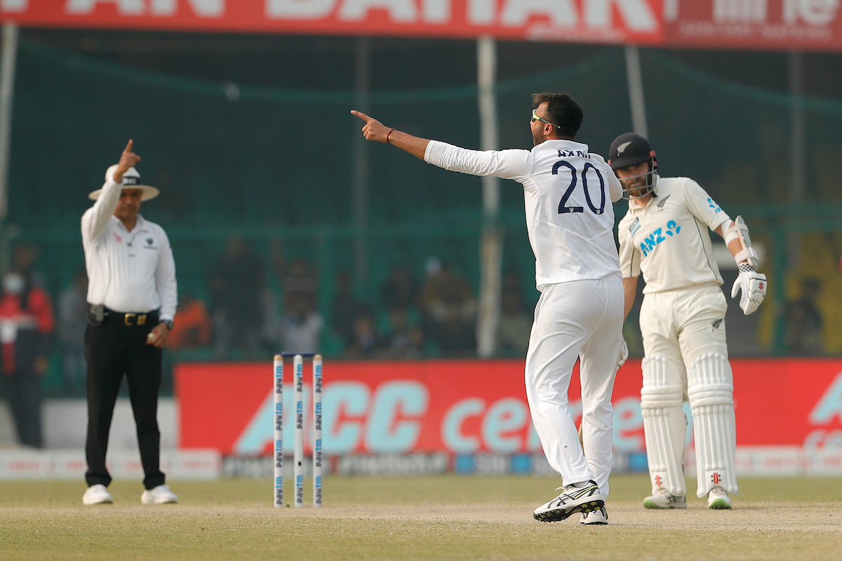 Axar Patel appeals successfully for leg before wicket against Henry Nicholls .