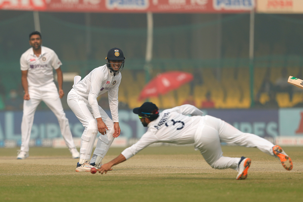 Shubman Gill watches anxiously as Ajinkya Rahane fails to latch on to a difficult chance from William Somerville.